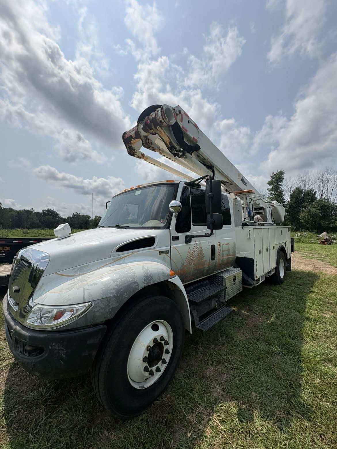 Morgan's Tree bucket truck with the boom raised