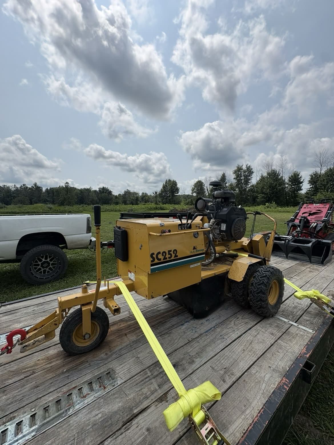 SC252 stump grinder strapped down on the equipment trailer